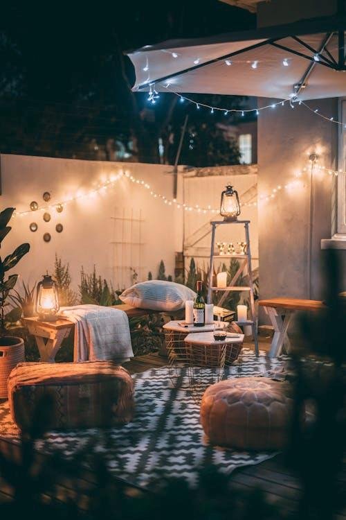 Cozy backyard patio with string lights overhead