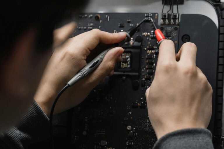 a person working on a circuit board