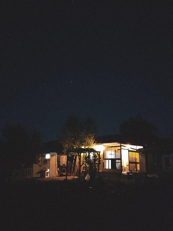 Small House Illuminated at Night