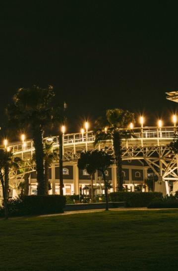Commercial outdoor space with pathway and building lights at night