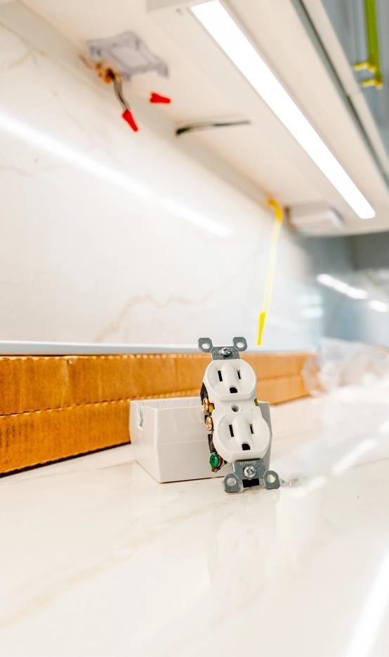 New electrical outlet being installed in a modern home.