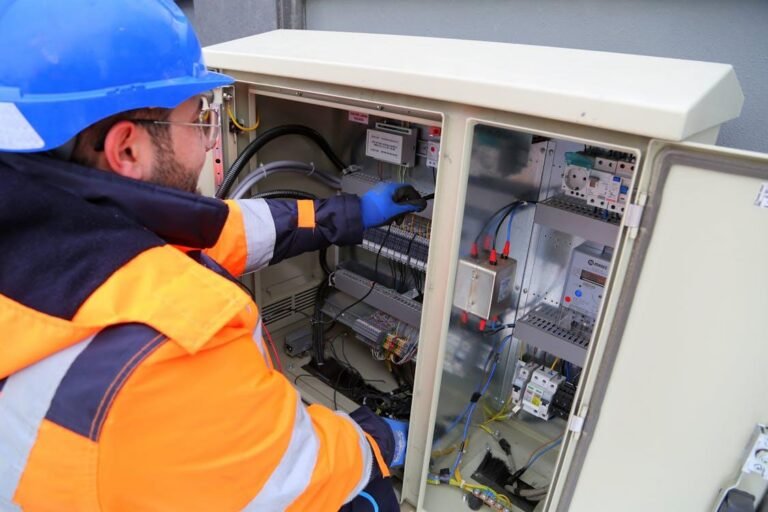 An electrician inspecting the fuse box