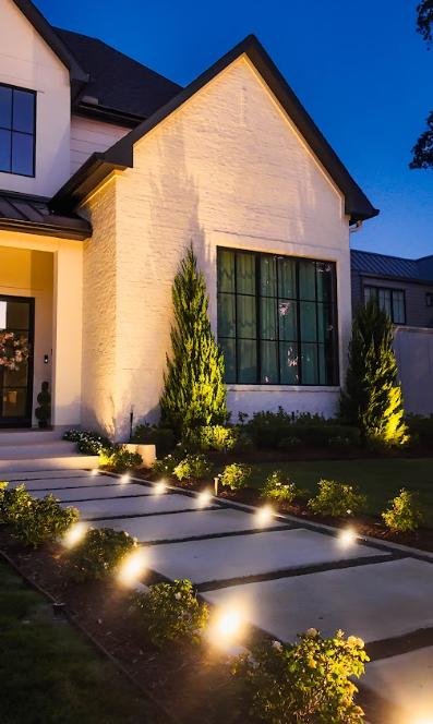 led-pathway-lighting-front-yard-houston-home LED pathway and landscape lighting illuminating the front yard walkway of a Houston residential home